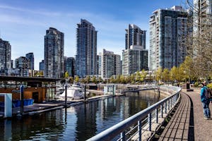 person wearing blue jeans besides gray steel fence 2416602 300x200 1